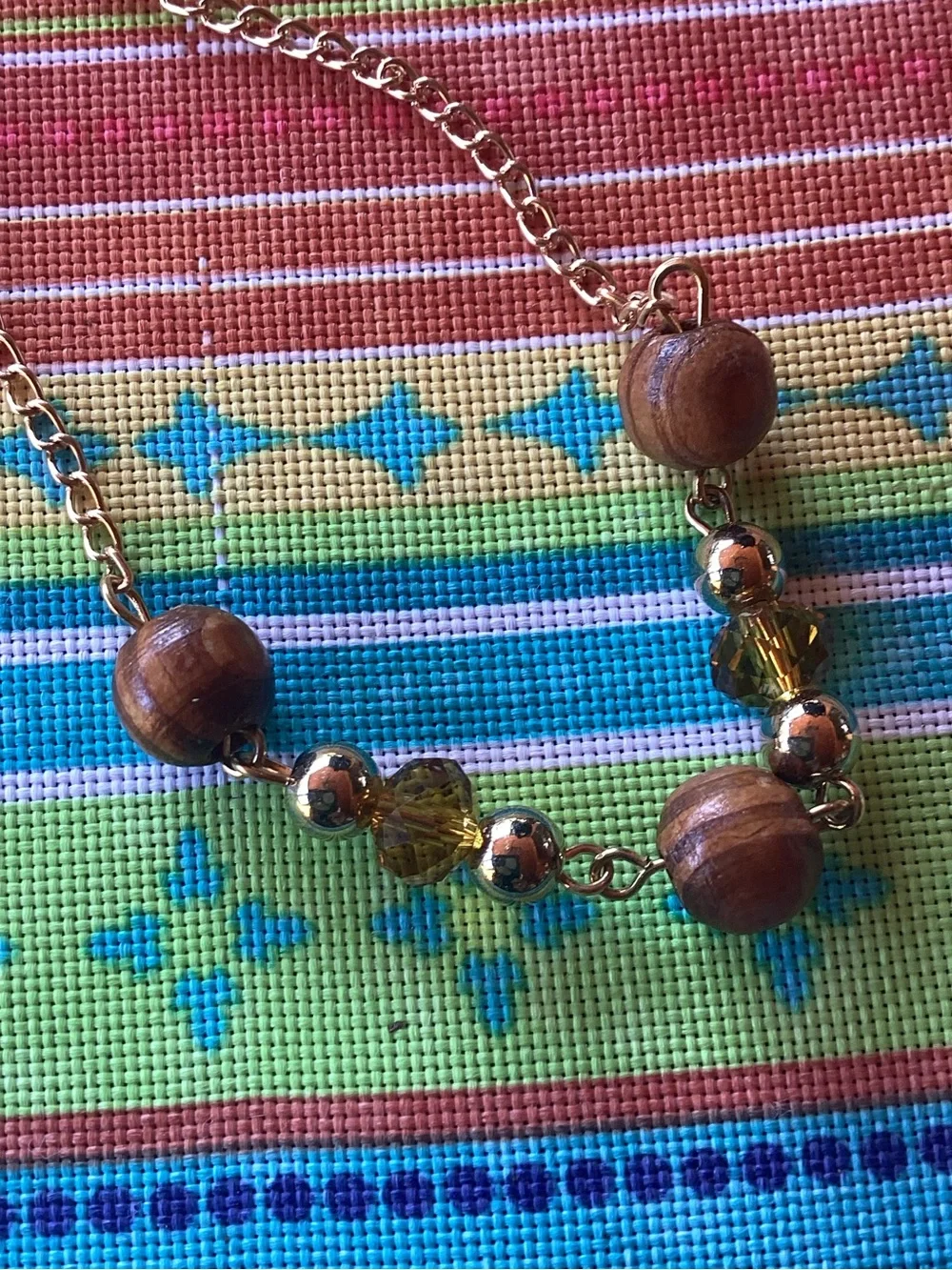 Superstar Accessories Necklace with wood, tassel and gold tone accents
